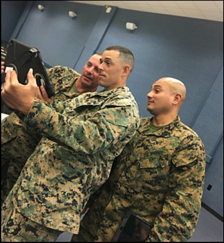 Marines looking at tablet